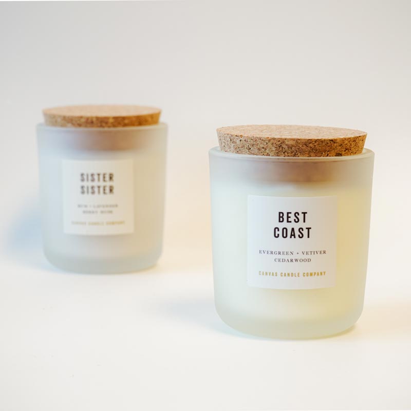 two candles with labels